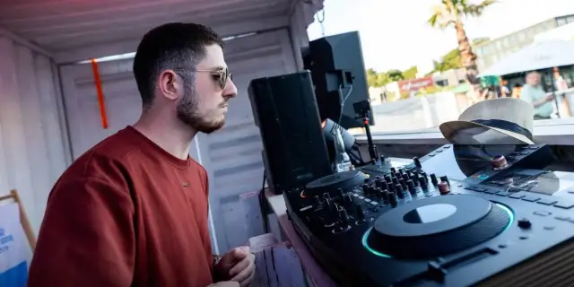 ASTR in profile mixing on CDJs outdoors